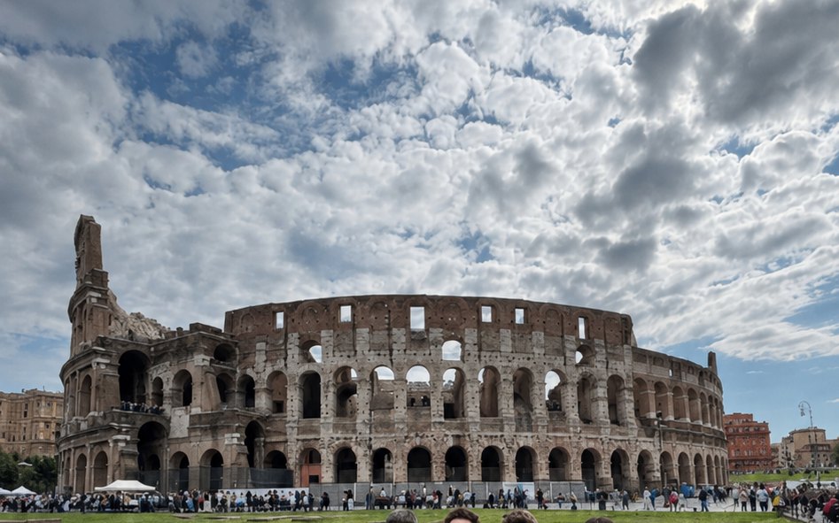 A company of friends in front of the Colosseum
