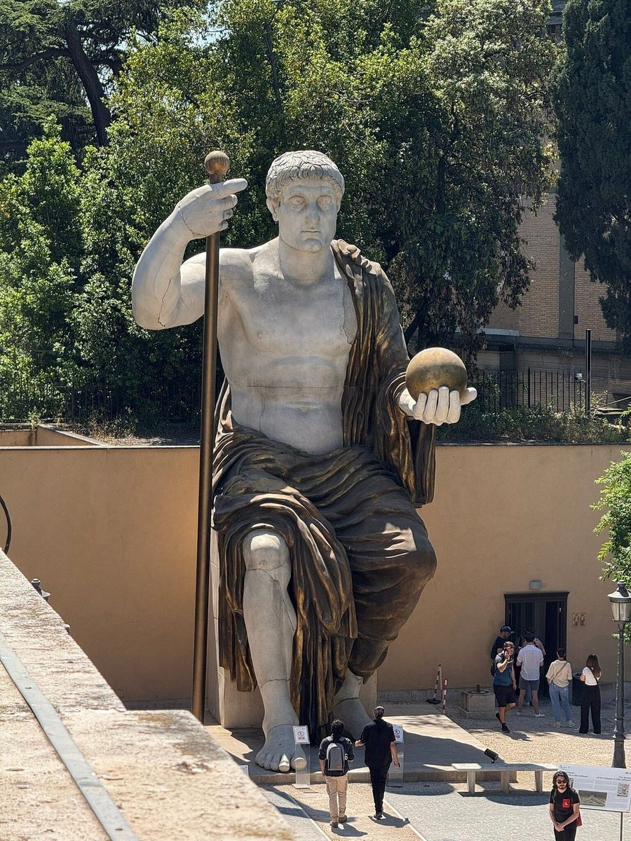 A colossal ancient statue in the courtyard of the Capitoline Museums