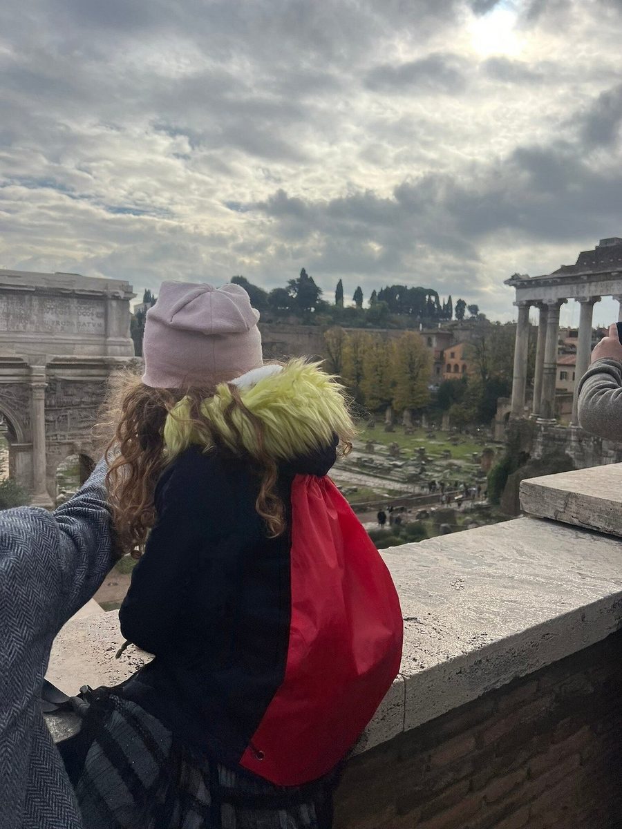 Children look down at the Roman Forum from above